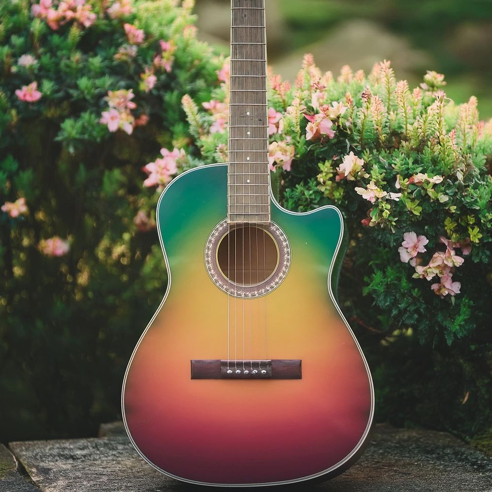 Firefly create a colorful asthetic guitar with flower, green bushes background 12218.jpg