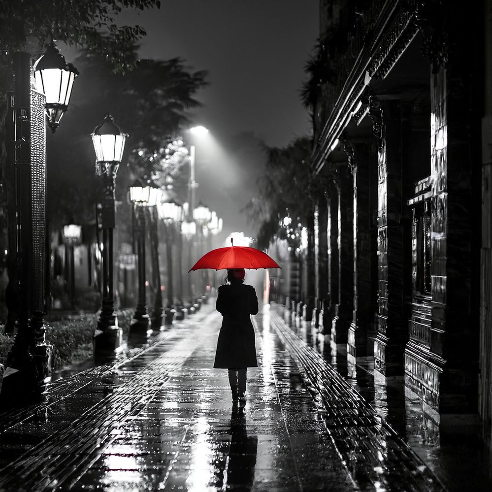 Firefly Create a monochrome image of a rainy time at night with girl walking in the aisle carrying a.jpg