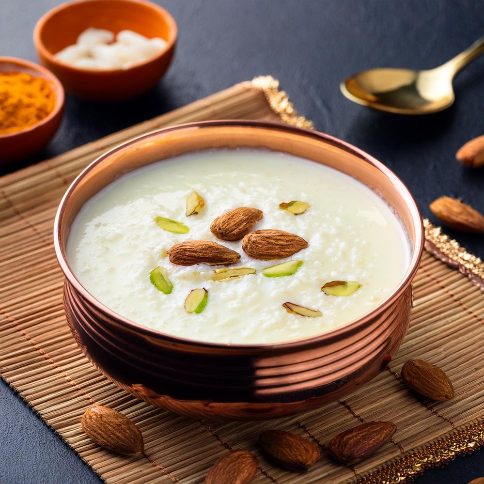 Firefly create a image of beautifully presented bowl of white kheer, a classic Indian rice pudding, .jpg