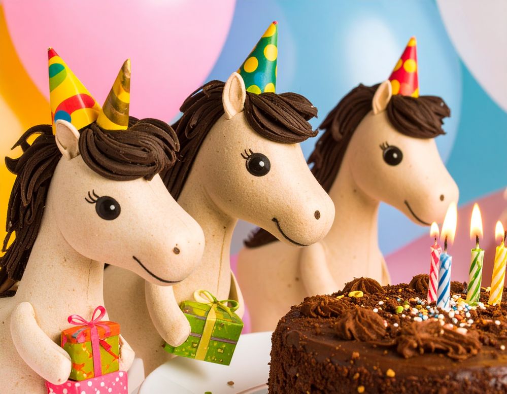 Firefly_cartoon unicorns wearing party hats standing around a chocolate cake with birthday ca 504739.jpg
